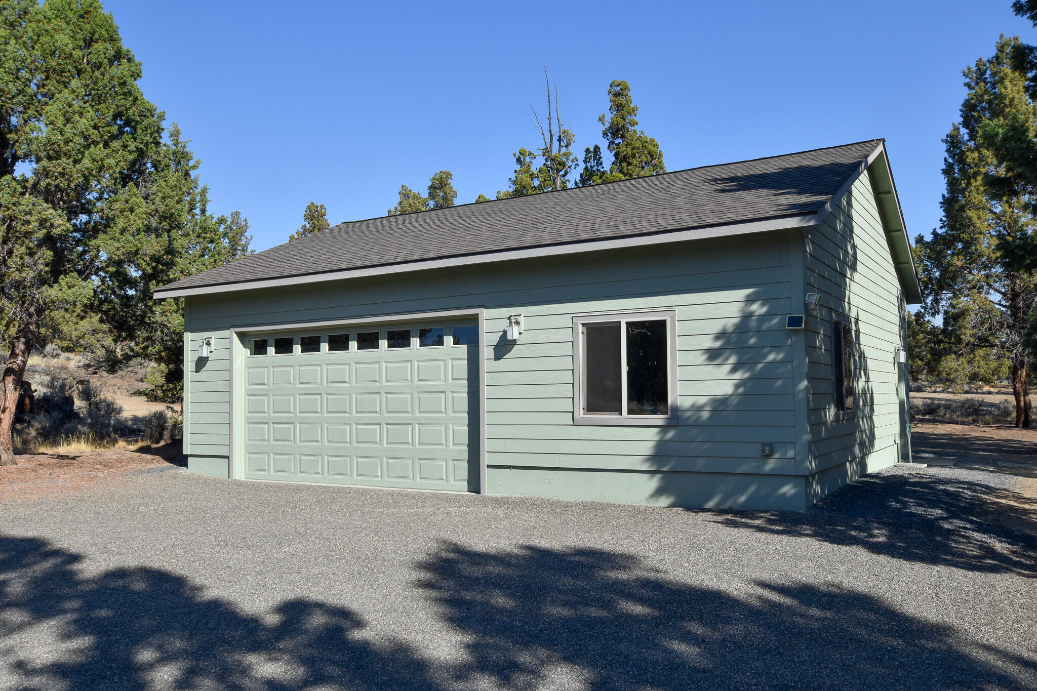 64730 Sylvan Loop Bend, OR 97701 - Photo 41 of 46 a view of a house with a garage