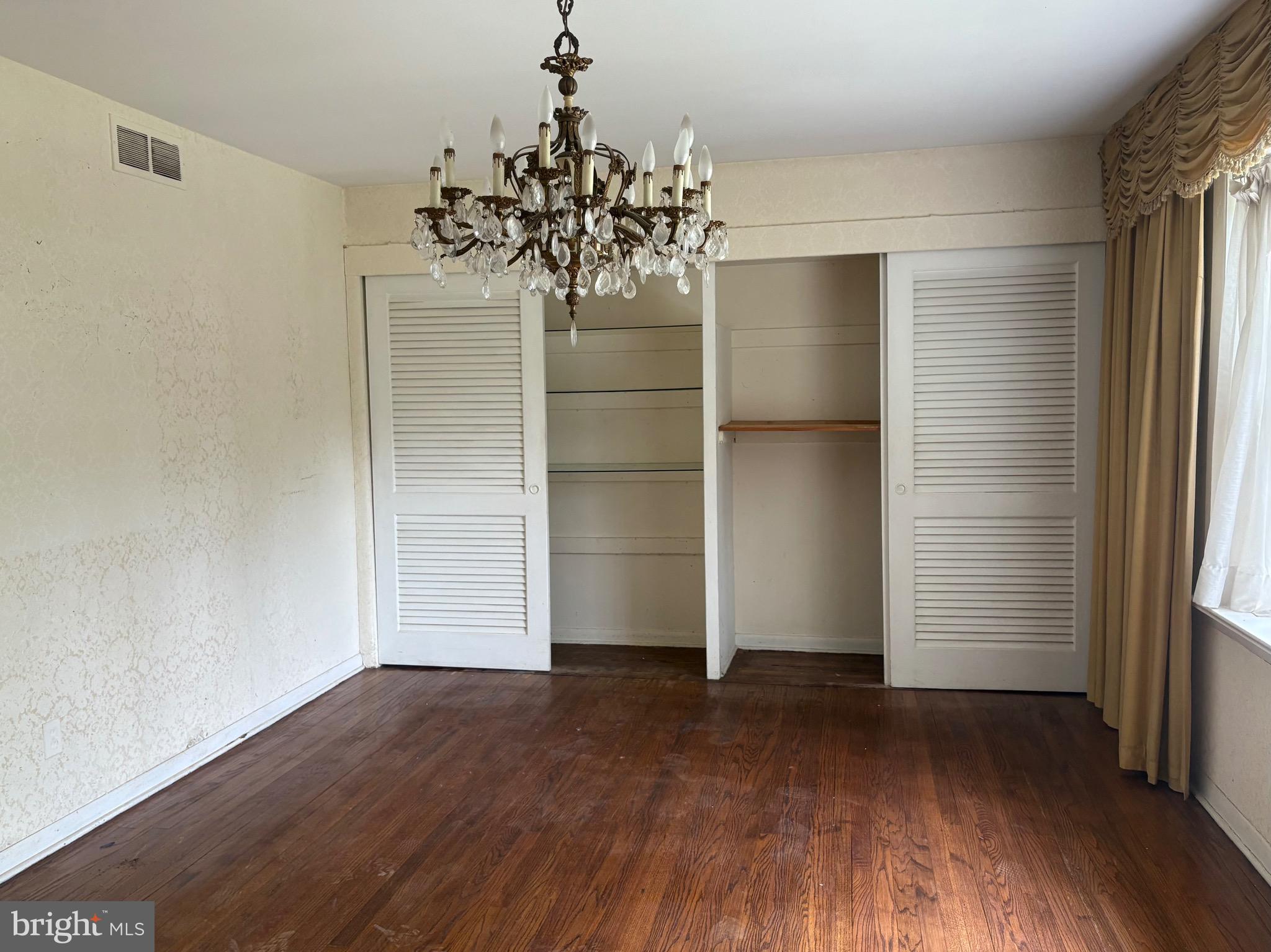 1041 Kipling Road Jenkintown, PA 19046 - Photo 13 of 23 an empty room with wooden floor and a window