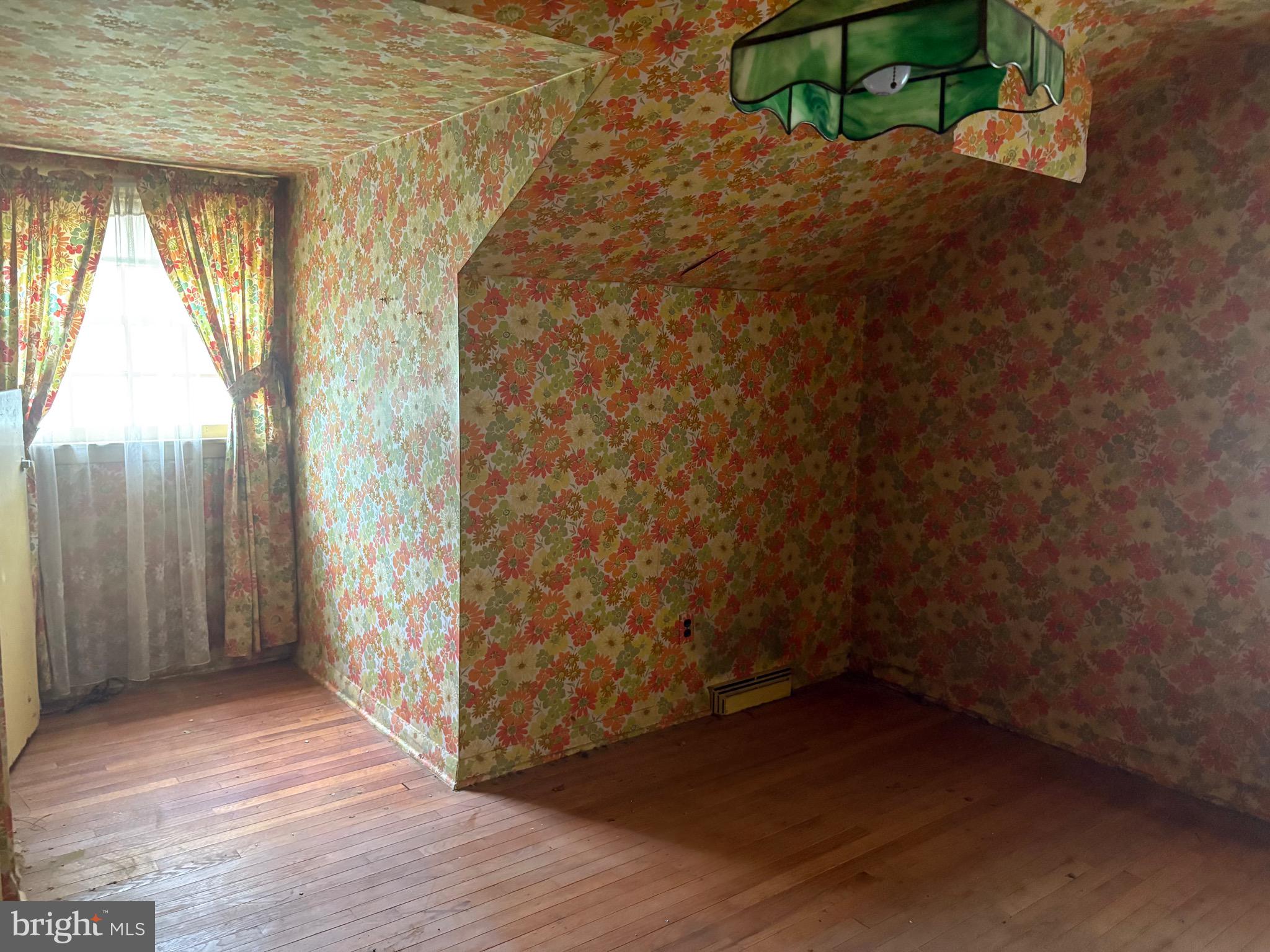 1041 Kipling Road Jenkintown, PA 19046 - Photo 18 of 23 a view of empty room with wooden floor and fan