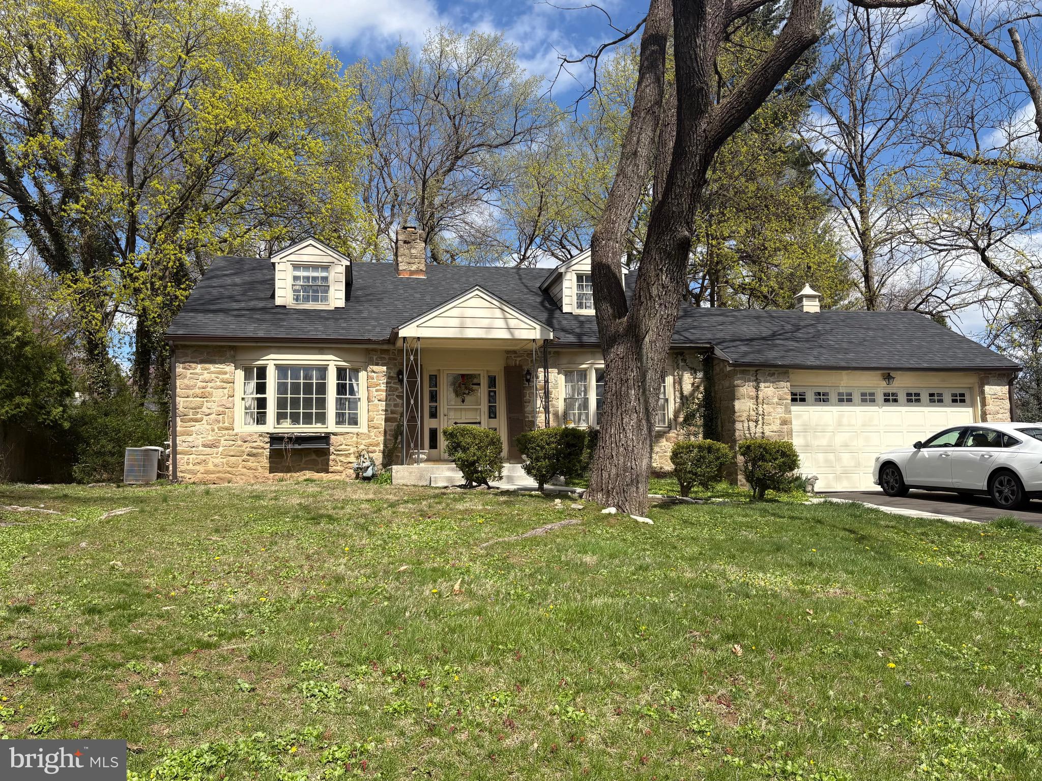 1041 Kipling Road Jenkintown, PA 19046 - Photo 2 of 23 a view of a house with backyard sitting area and garden