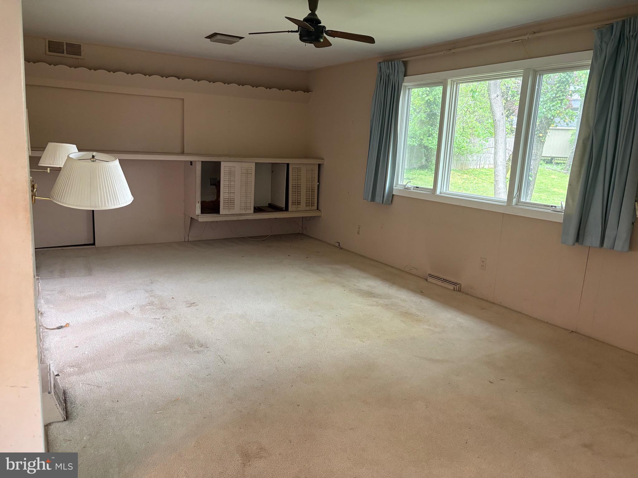 1041 Kipling Road Jenkintown, PA 19046 - Photo 5 of 23 an empty room with windows and cabinet