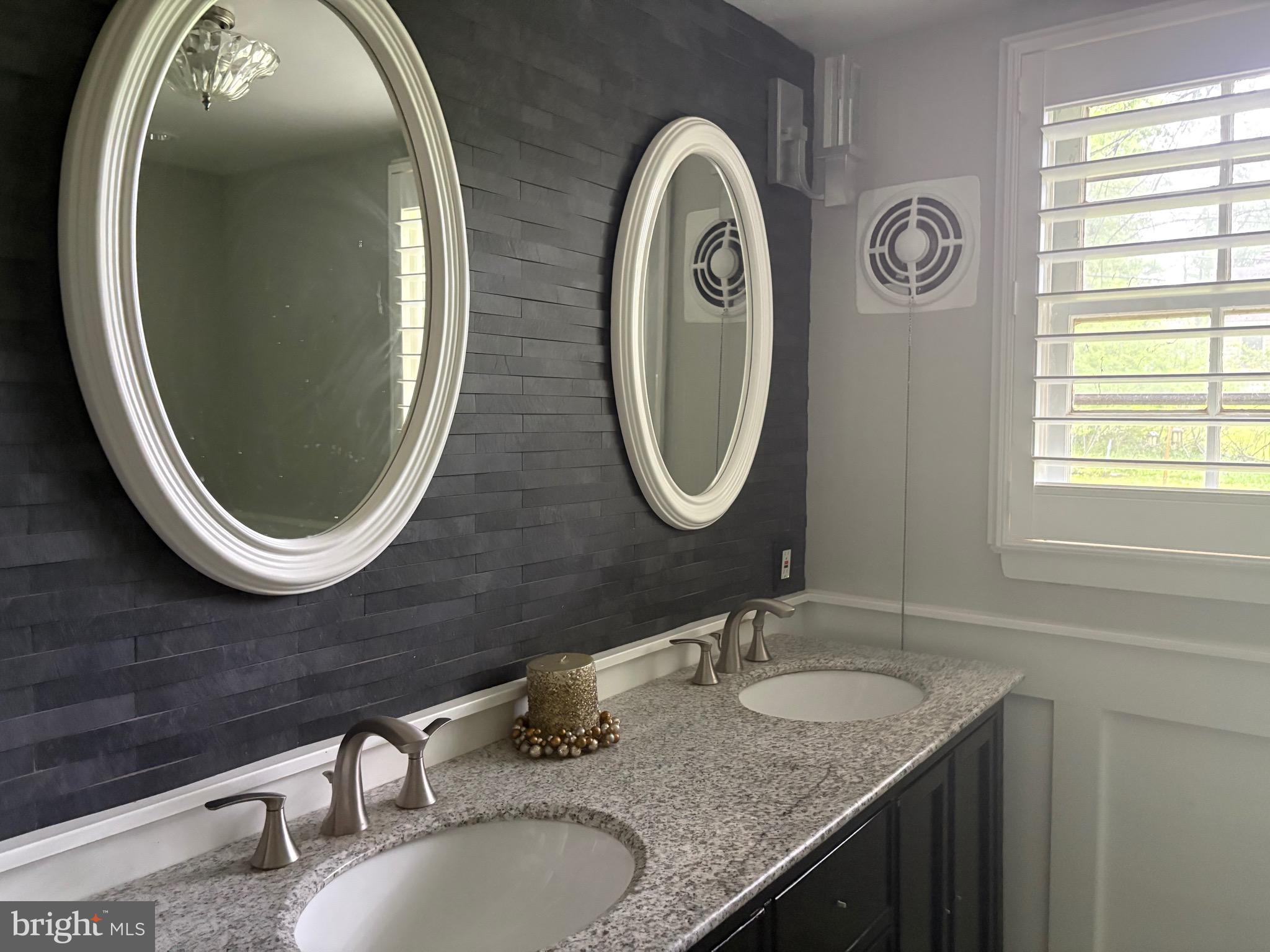 1041 Kipling Road Jenkintown, PA 19046 - Photo 8 of 23 a bathroom with a granite countertop double vanity sink and a mirror