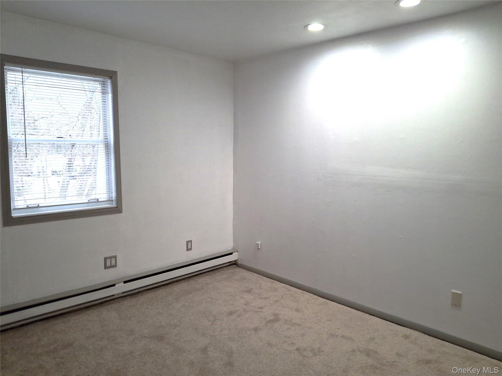 18 White Gate Road, Unit C Wappingers Falls, NY 12590 - Photo 14 of 21 an empty room with a window