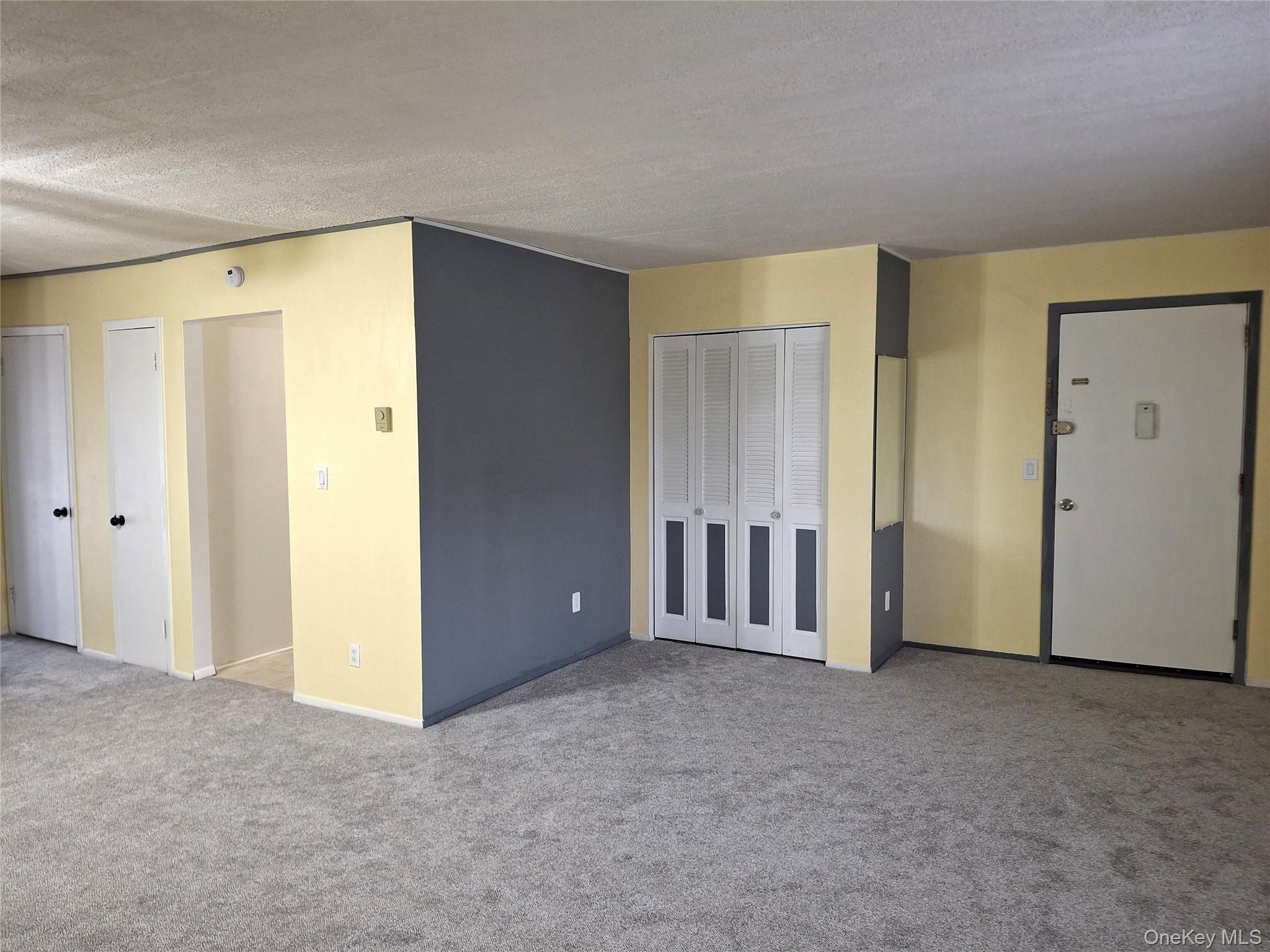 18 White Gate Road, Unit C Wappingers Falls, NY 12590 - Photo 2 of 21 an empty room with windows