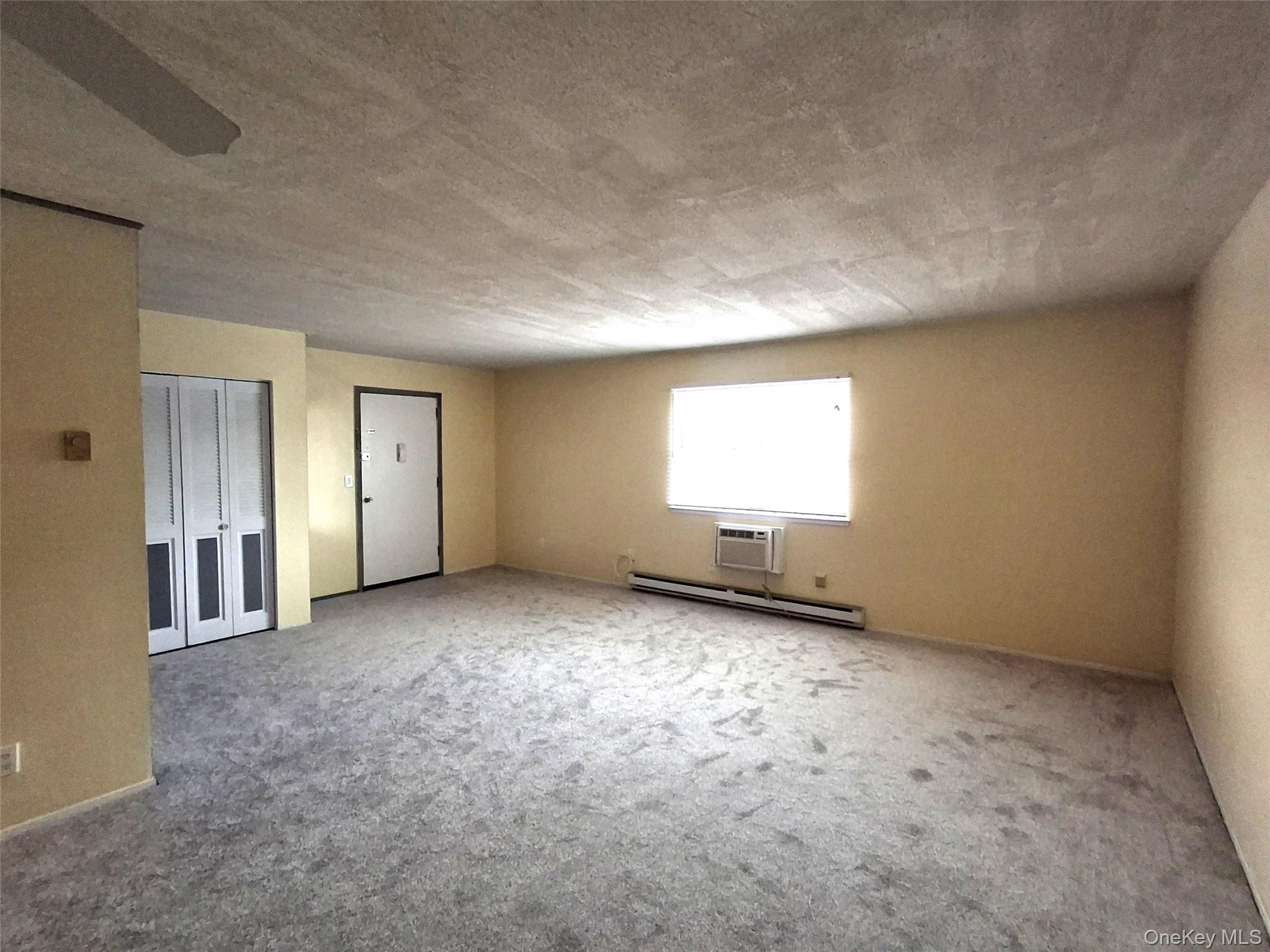 18 White Gate Road, Unit C Wappingers Falls, NY 12590 - Photo 3 of 21 an empty room with windows