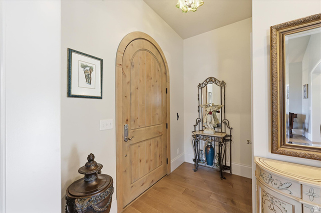 930 Price Farm Court Midway, UT 84049 - Photo 19 of 42 Foyer entrance with solid wood arched front door, quarter sawn white oak flooring and beautiful walkways