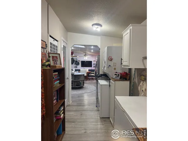 a kitchen with stainless steel appliances kitchen island granite countertop a refrigerator a stove and a microwave