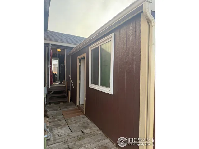 a view of a door and a hallway