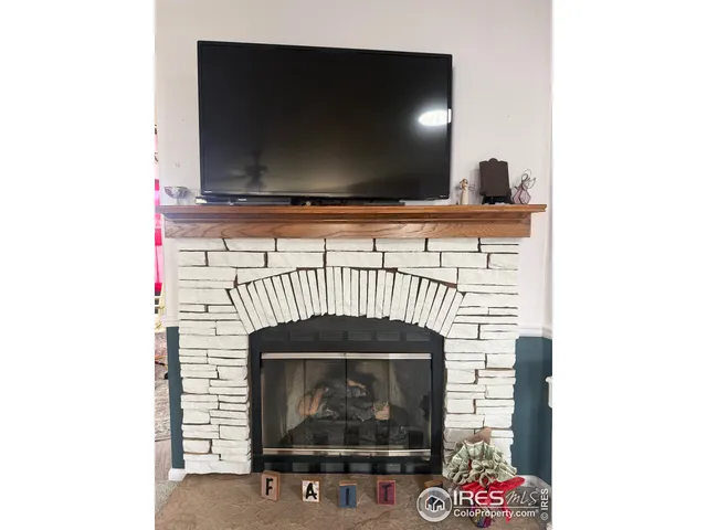 a fireplace with a flat screen tv
