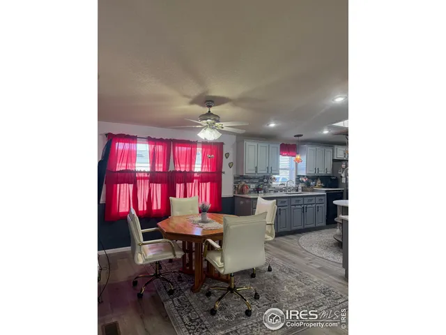 a view of a dining room with furniture and window