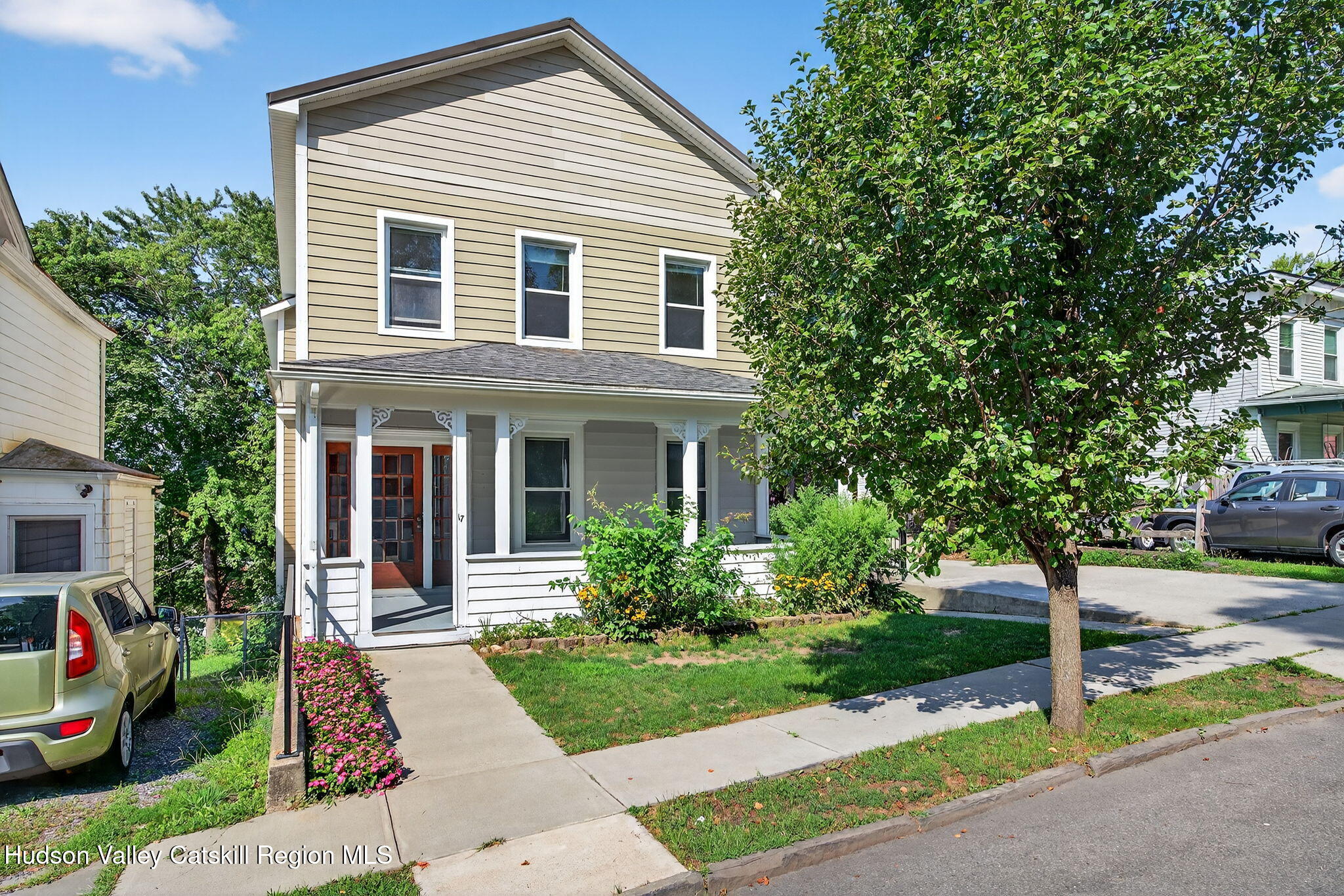 a front view of a house with garden