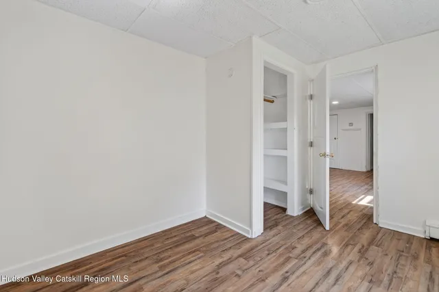 a view of wooden floor in an empty room