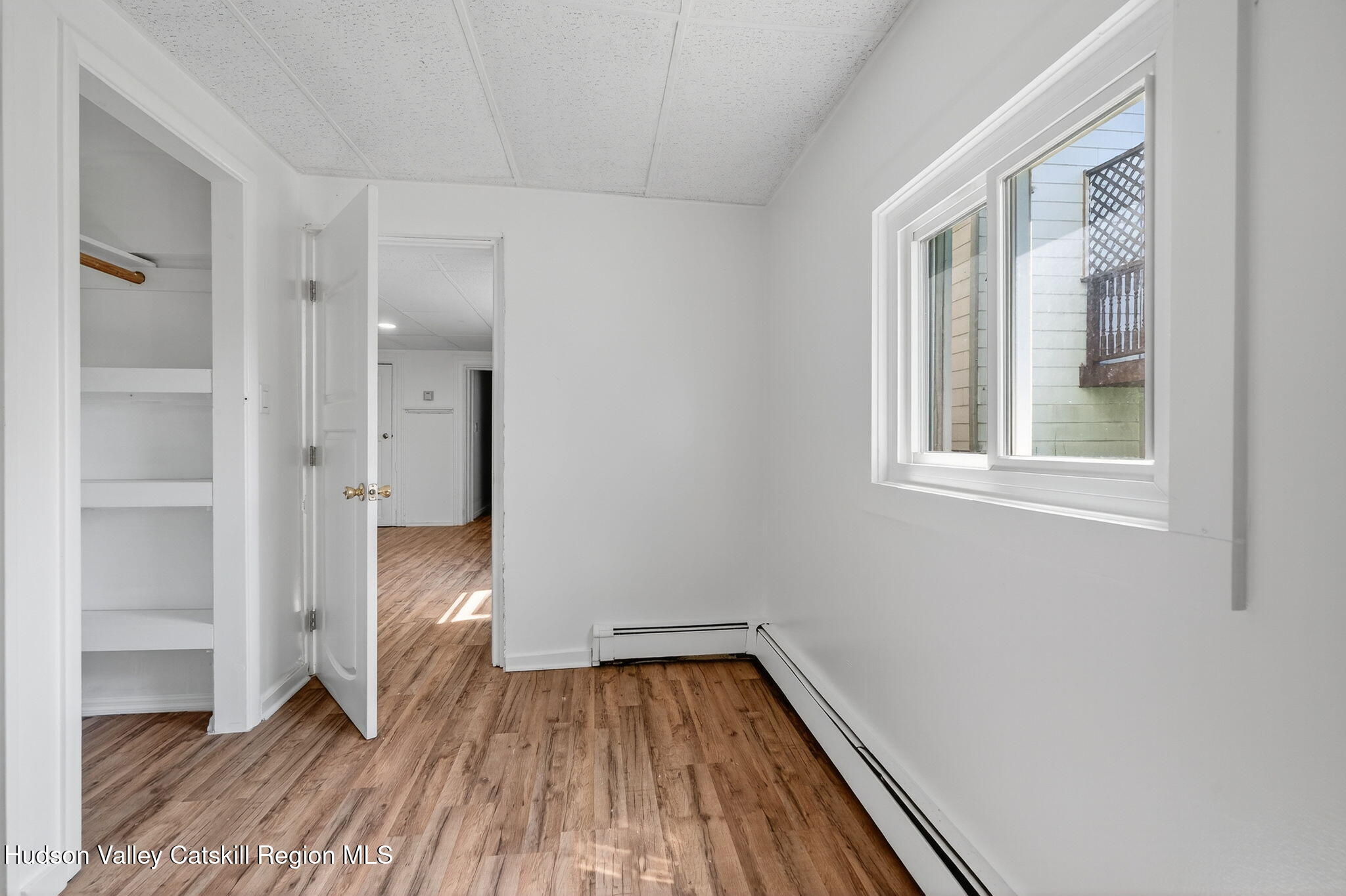 17 New Street, Unit # 3 Catskill, NY 12414 - Photo 15 of 23 a view of a room with wooden floor and a window