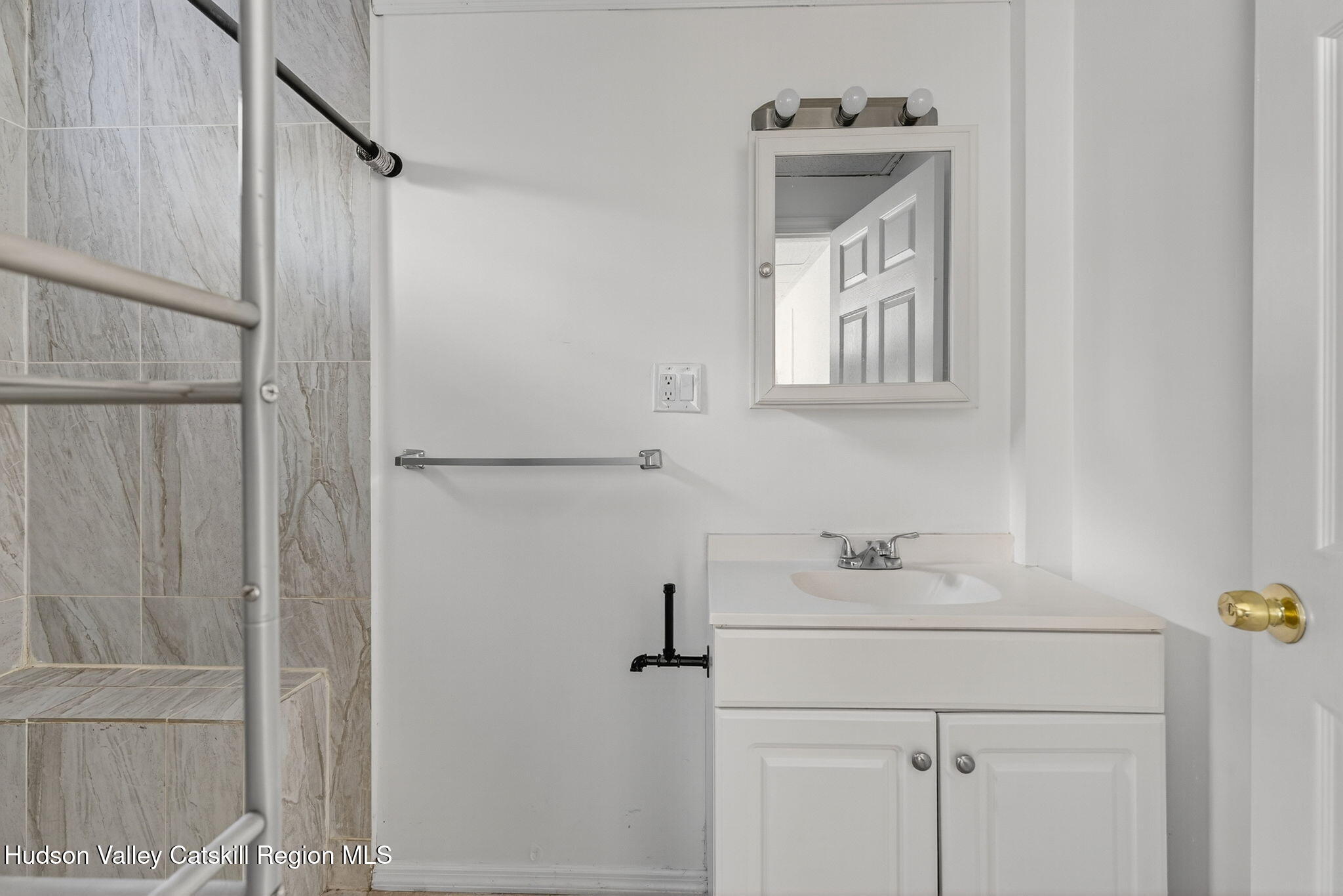 17 New Street, Unit # 3 Catskill, NY 12414 - Photo 19 of 23 a bathroom with a sink a vanity and a mirror