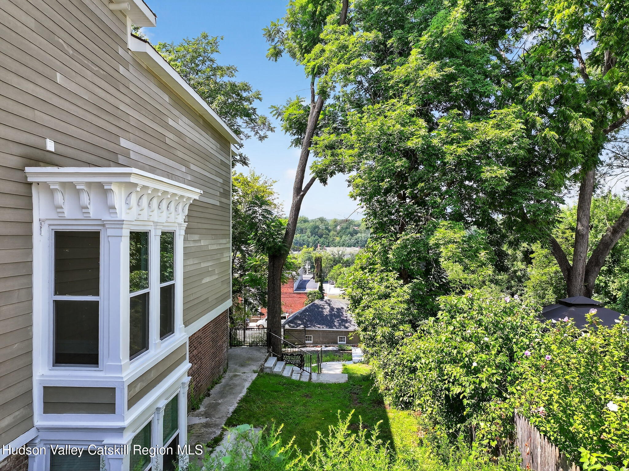 17 New Street, Unit # 3 Catskill, NY 12414 - Photo 22 of 23 a view of a patio with table and chairs and potted plants