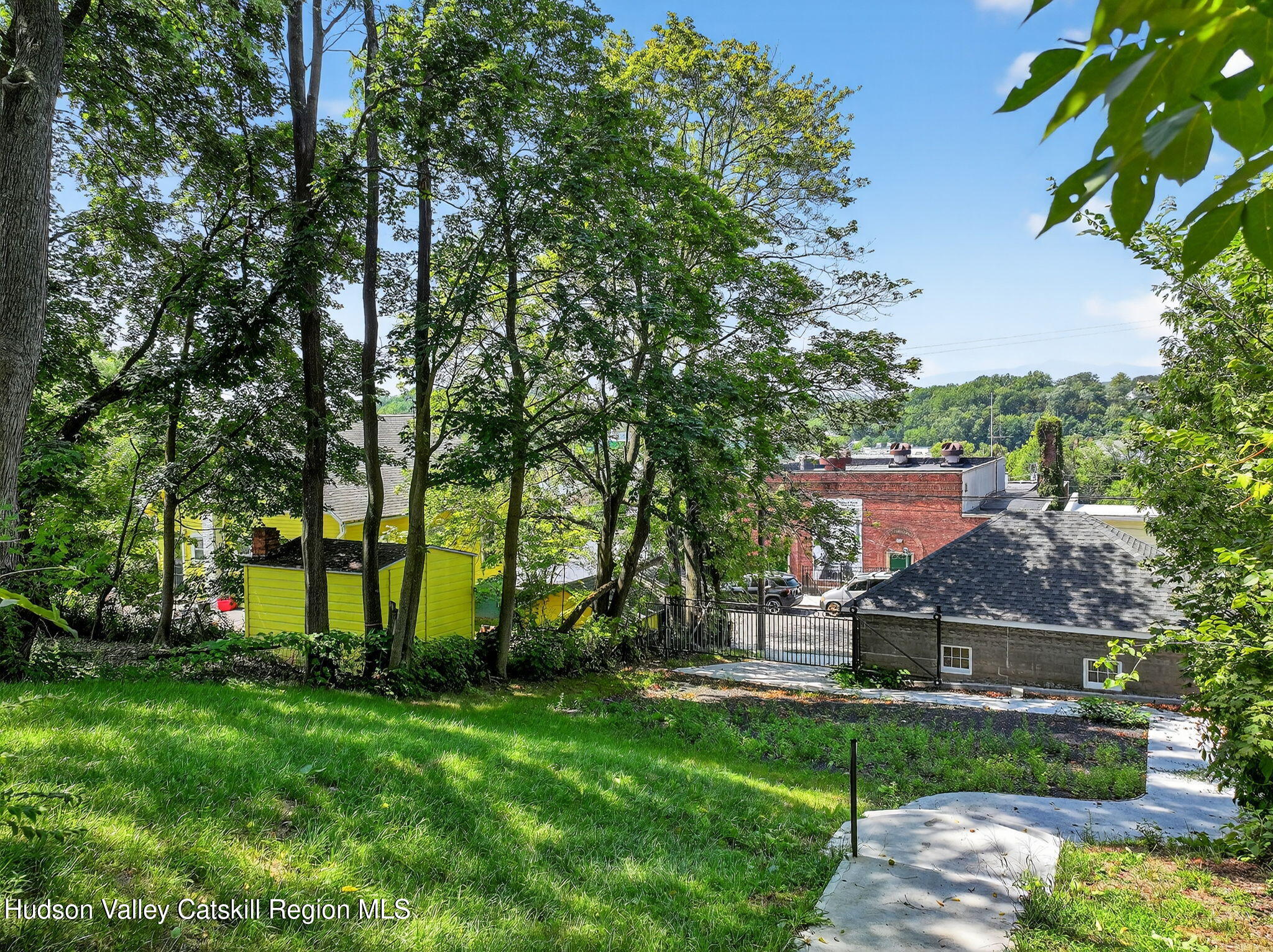 17 New Street, Unit # 3 Catskill, NY 12414 - Photo 23 of 23 a view of a garden with plants and large trees