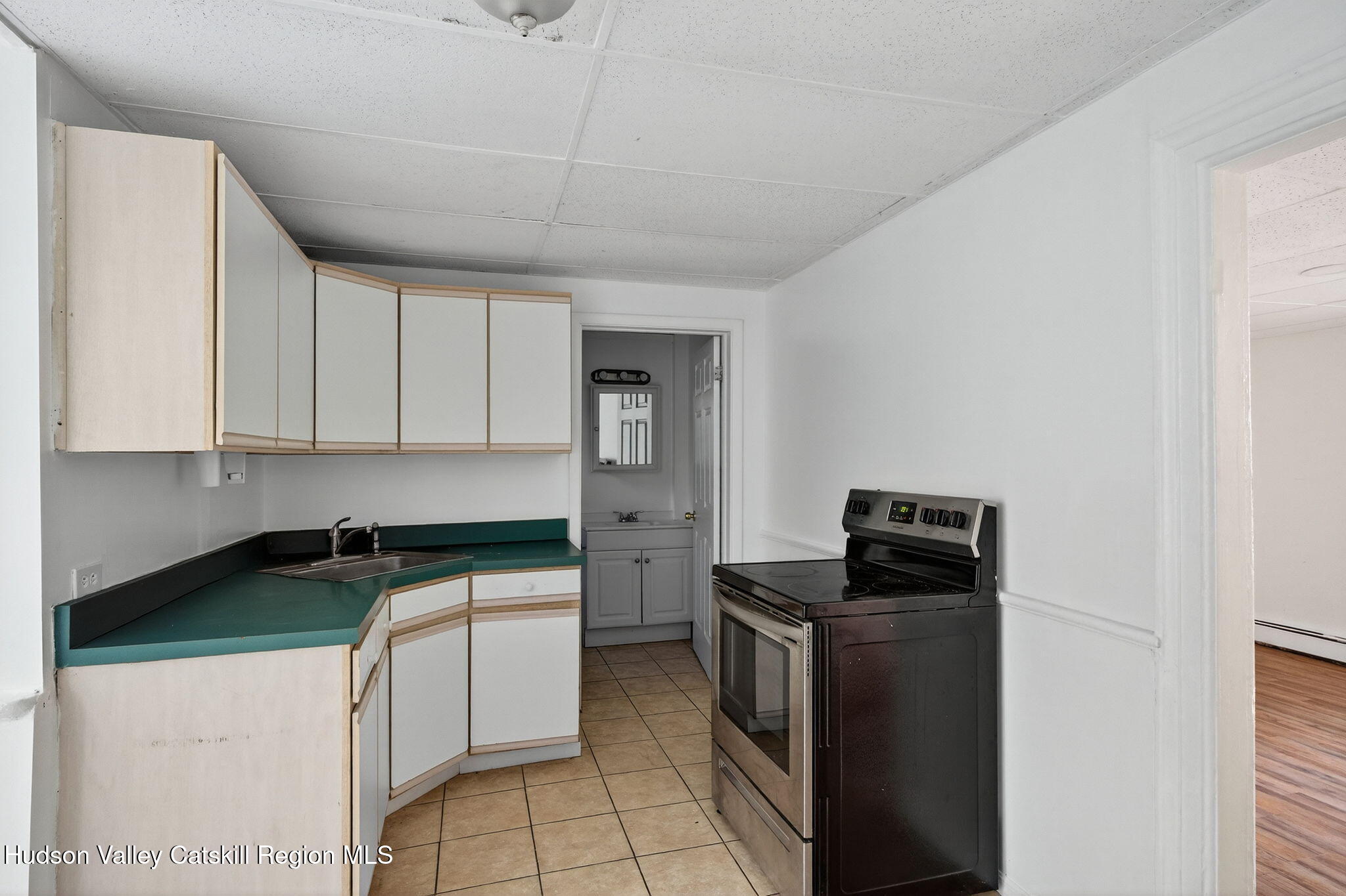 17 New Street, Unit # 3 Catskill, NY 12414 - Photo 4 of 23 a kitchen with a stove and a microwave