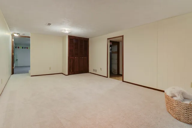 a view of an empty room and a window