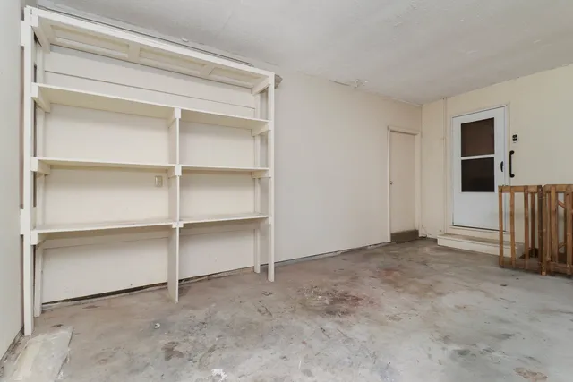 a view of a livingroom with wooden floor and staircase
