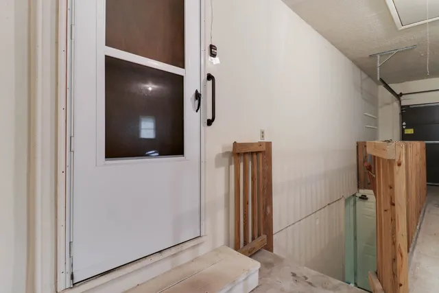 a front view of house with yard and trees around