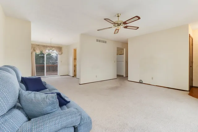 a living room with furniture and window