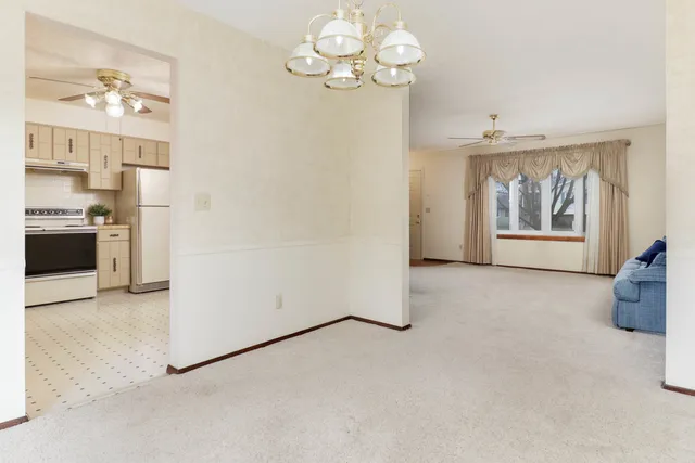 a view of a kitchen with furniture and a window