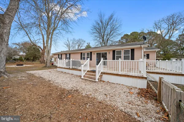 a house with trees in front of it