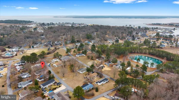 an aerial view of a house with outdoor space