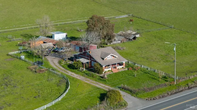 an aerial view of a house with a garden