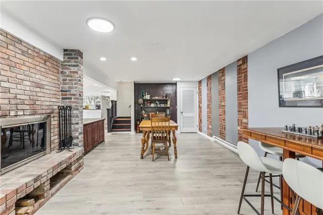 a dining room with furniture and wooden floor