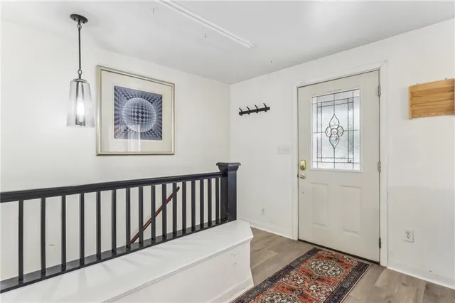 a view of a hallway with windows