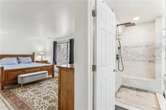 a bedroom with a bed and a rug