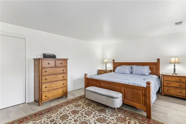 a bedroom with a bed and a cabinets