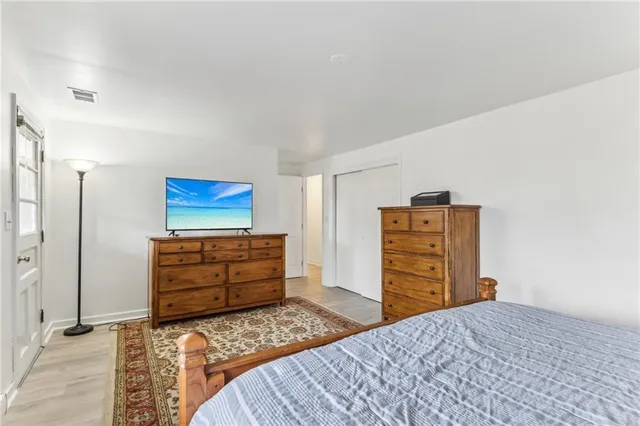 a bedroom with furniture and closet