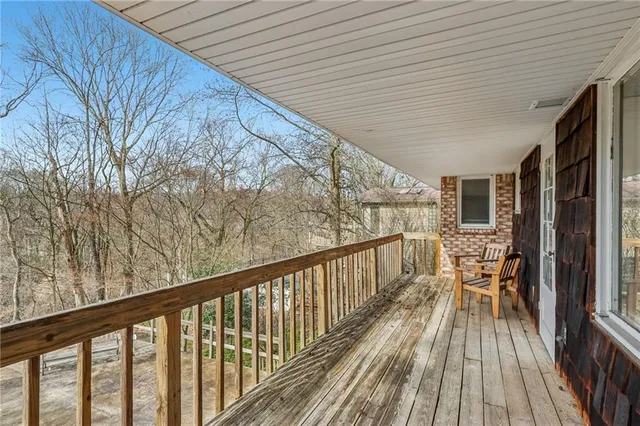 a view of balcony with wooden floor