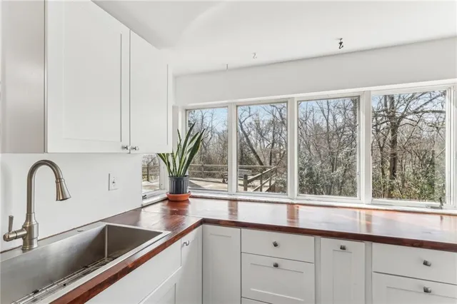 a kitchen with a sink and a window