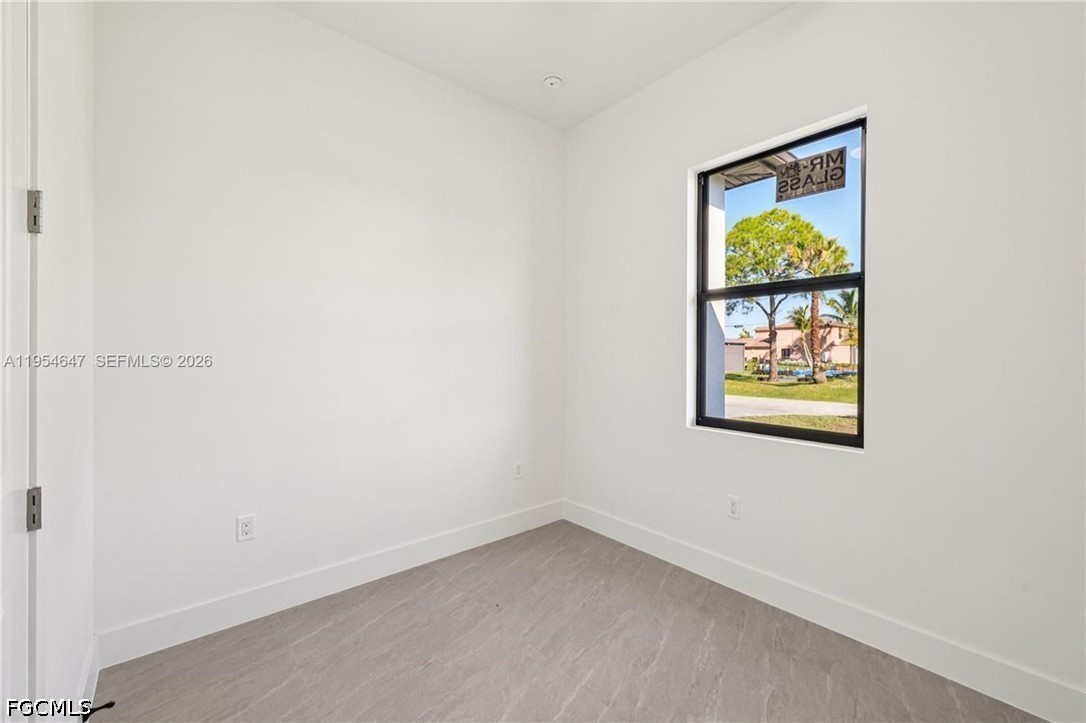 4402 East 19th Street Lehigh Acres, FL 33972 - Photo 11 of 27 an empty room with a window
