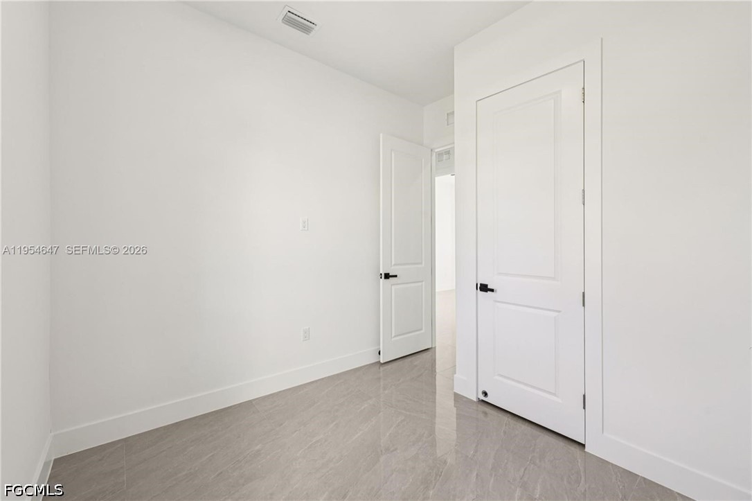 4402 East 19th Street Lehigh Acres, FL 33972 - Photo 12 of 27 a view of an empty room