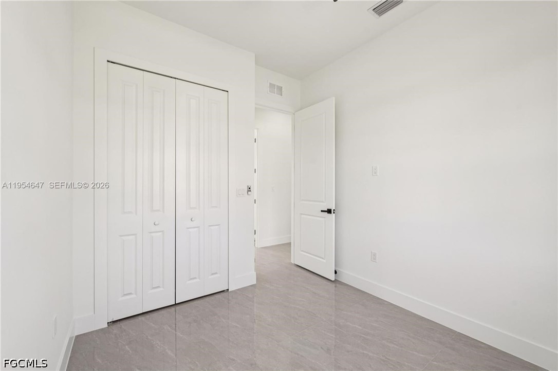 4402 East 19th Street Lehigh Acres, FL 33972 - Photo 17 of 27 a view of an empty room