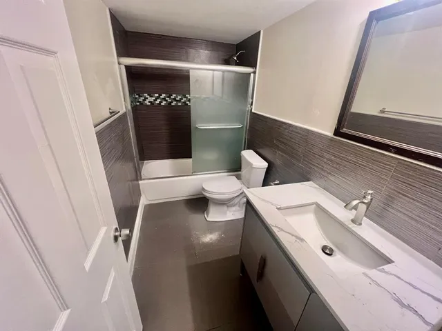 a bathroom with a sink and toilet