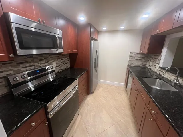 a kitchen with a stove and a microwave