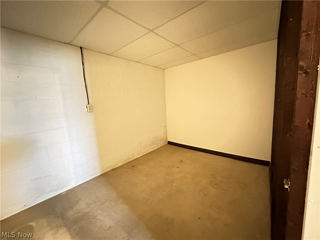 2408 Brown Road Ashtabula, OH 44004 - Photo 22 of 27 Spare room featuring a drop ceiling and concrete floors