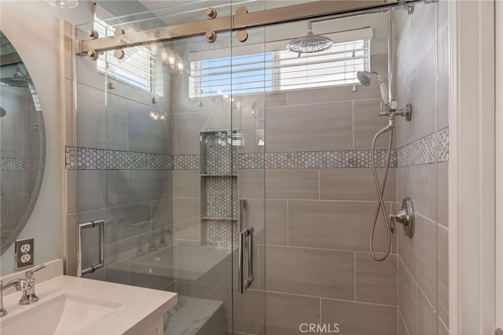 19584 Jill Court Riverside, CA 92508 - Photo 16 of 31 a bathroom with a shower and a sink