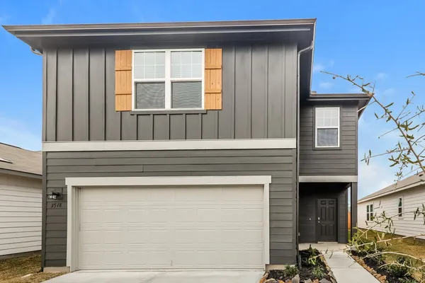 a front view of a house with a outdoor space