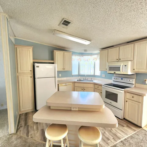 a view of cabinets with wooden floor