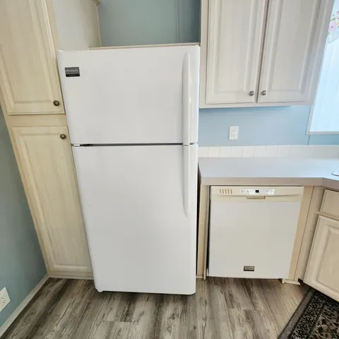 a stove top oven sitting inside of a kitchen
