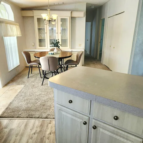 a view of a dining room with furniture window and outside view