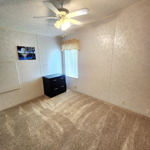 a bed room with a bed and a window