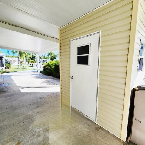 a view of yard with swimming pool and green space