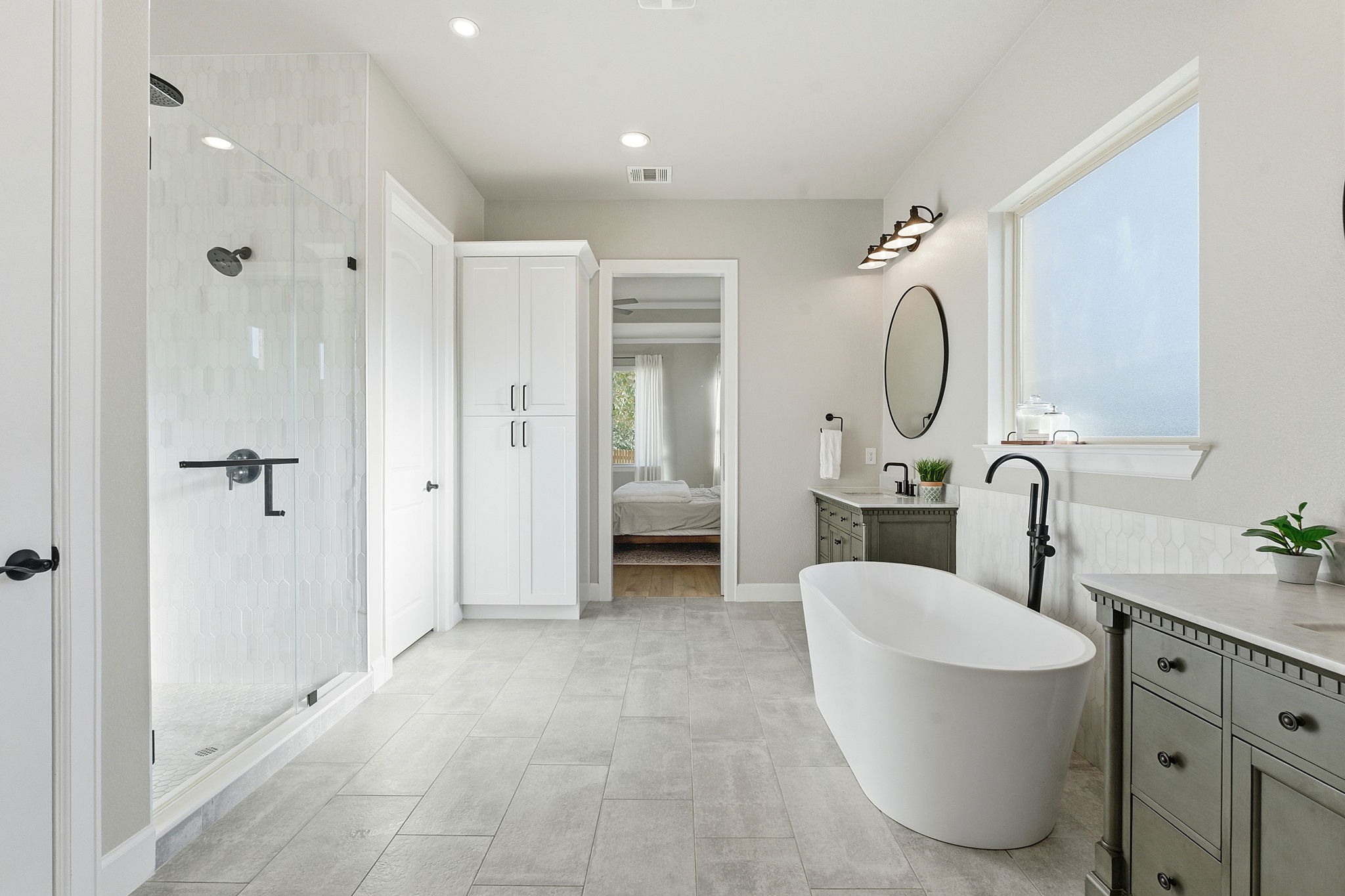 512 Choke Canyon Lane Georgetown, TX 78628 - Photo 15 of 37 Ensuite bathroom featuring a freestanding tub, vanity, a shower stall, and recessed lighting